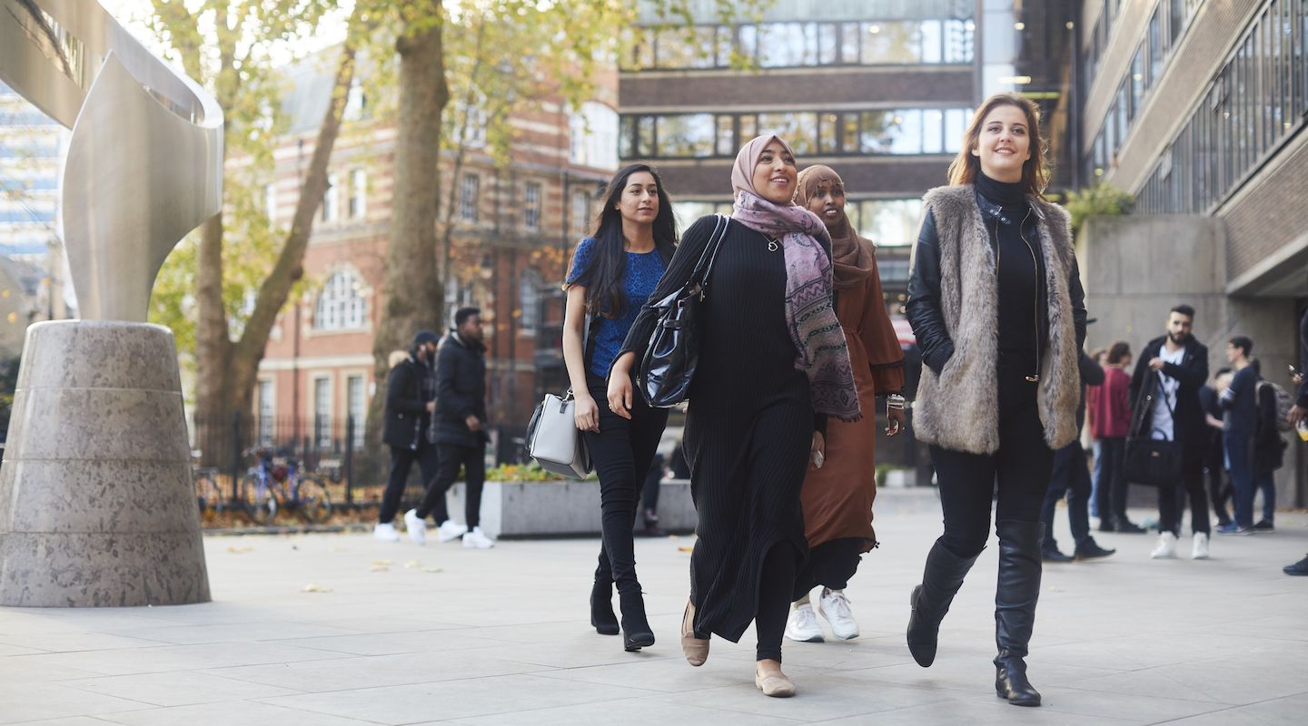 Group of students walking outside the new main entrance